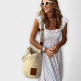 Maxikjole ruutuaset rinnalle ja röyhelöillä