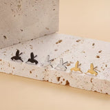 Kolibrin onnellisuusnappikorvakorut