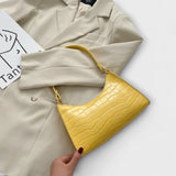 Lora - Kiiltävä nahkainen laukku