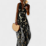 V-aukkoinen mekko paljeteilla