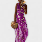 V-aukkoinen mekko paljeteilla