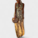 V-aukkoinen mekko paljeteilla