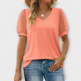 Rema - V-halsinen toppi läpinäkyvillä hihoilla